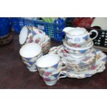 An Aynsley bone china Teaset decorated in floral sprays and scroll border, comprising six Cups and