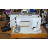 A cased electric Necchi type 565 Sewing Machine