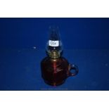 A small cranberry glass Oil Lamp