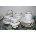 A pretty hand painted 19th c. Tea/Coffee, white ground with blue and white and comprising eight Tea