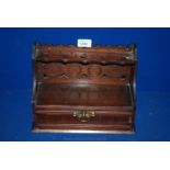 An Edwardian carved wood Pipe Rack in the shape of a dresser with a drawer.