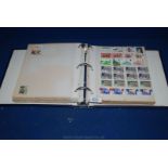 A large blue Stamp Album containing various Stamps