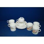 An Aynsley Coffee set comprising six coffee Cans and saucers in 'Cottage Garden' pattern