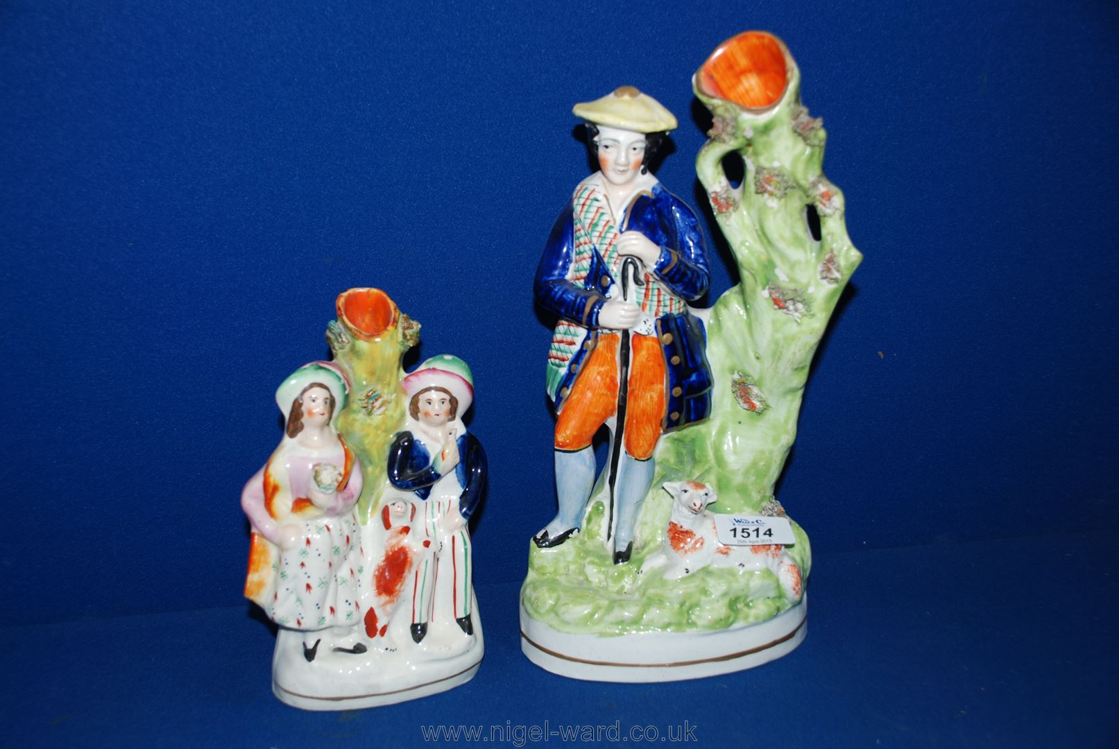 Two Flatback spill Vases, one of a Shepherd with a lamb, 12'' tall and the other of a couple with a