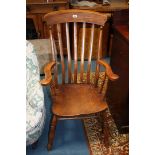 A 19th c. Country made Grandfather Chair, having lath back, scroll end arms, Elm seat, standing on