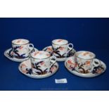 Four Coalport Coffee Cans and saucers, white ground with blue, orange and gilt decoration.