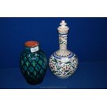 A black and turquoise hand painted Middle Eastern Vase with signature to base, 8 1/2'' high and a