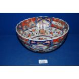 A good Imari Bowl decorated with panels of birds and butterflies, and scrolling flowers,