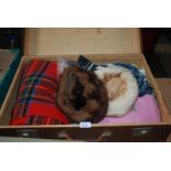 Two fur Hats, assorted scarves and travel Rug, contained in initialled Suitcase