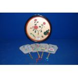 A circular Oriental carved framed tourist Display along with four hand painted Chinese Fans