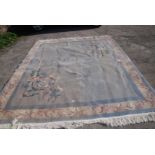 A large Chinese Rug in blue, pink and cream, 120'' x 94'' approx.