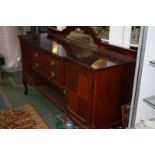 A late Victorian Mahogany Sideboard with dome top upstand having moulded edges and 'D' shaped