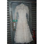 An 'Ellis exclusive model' lace tiered Wedding Dress, size 36