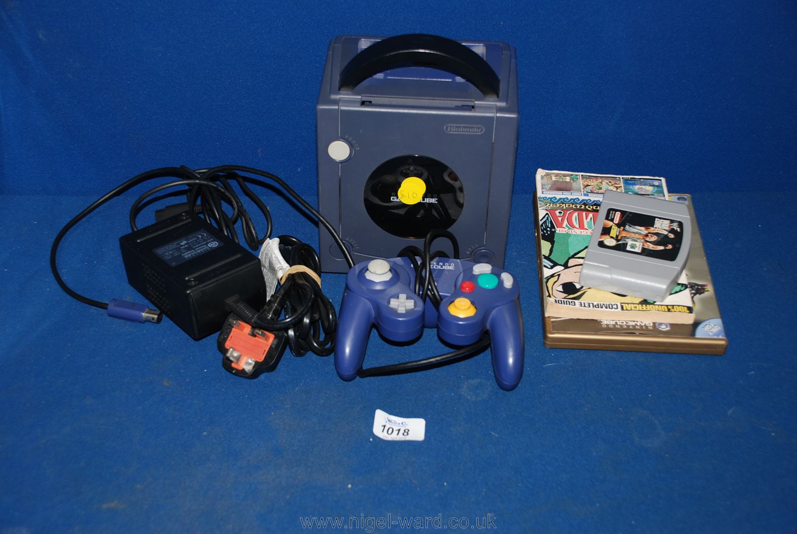 A Nintendo Game Cube vide games Console with Legend of Zelda game and controller.