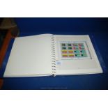 A blue Stamp Album containing United Nations Stamps from 1980's and 90's