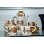 A Palissy coffee pot, six cups and saucers, sugar bowl and milk jug