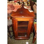 A Victorian Walnut corner floor standing Display Cabinet having fret cut upstand back,