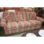 A modern large three seat Settee, having scroll end arms,