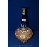 A Royal Doulton bottle shaped Vase, the bulbous shaped base incised with gilt and floral motifs,