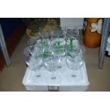 Six green stemmed Wine Glasses and six plain wine glasses