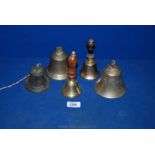 Three old brass Bells and two Hand Bells