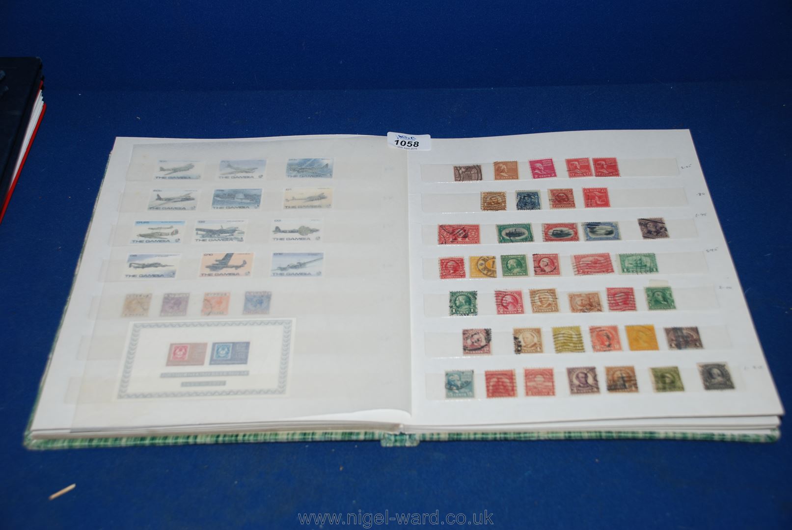 A green Stamp Album/Stock Book containing a quantity of World mix Stamps - Thematic issues Great