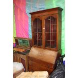 An Edwardian Mahogany Bureau Bookcase, moulded cornice over pair of opposing, eight pane glazed