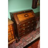 A South African stinkwood Bureau with plain top, the inlaid fall opening to reveal six pigeon holes,