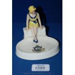 A 1930's Arcadian souvenir Ashtray from Ryde  featuring a young Lady sitting on a bench