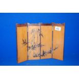 A Japanese four fold miniature hardwood Screen, 22 cms high and 30 cms long overall,