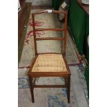 An Edwardian Mahogany inlaid bedroom Chair, twin bar back, cane seat,