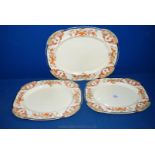 A set of three graduated Meat Plates by Wood & Sons with scalloped edges.