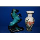A pottery figure of a rearing horse, plus a green and white vase