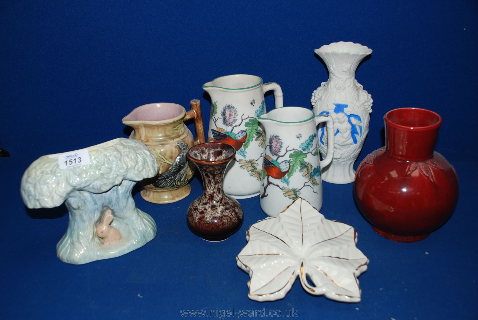 A quantity of Jugs and vases including Sylvac flower vase, graduated jugs with bird decoration,