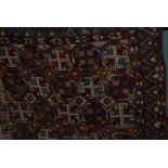 A vintage Afghan Tribal Kelim with seven rows of four octagons, 8'6'' x 6'.