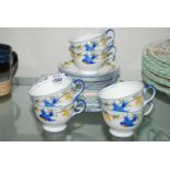 A pretty Aynsley part Teaset, white ground with bluebirds and yellow floral decoration, comprising