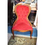 A modern reproduction hotel reception Chair, having show frame hoop back,