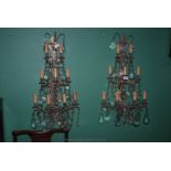 A pair of nine branch Italian[ metaL] BRASS  back wall Chandeliers with glass droppers