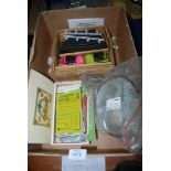 A quantity of miscellanea including clock case glass covers, odd clock keys, cars and track,