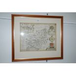 A framed Speed Map of Carmarthenshire, dated 1610, hand coloured