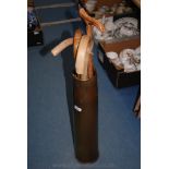 A 105mm Brass Shell Case together with four Walking Sticks