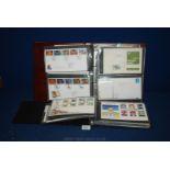 An album containing Royal Mail Presentation Pack, album of First day Covers