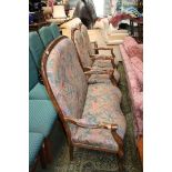 A modern stained Pine show frame two seater high hoop back Sofa in multi coloured floral patterned