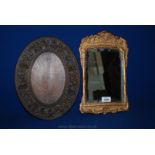 A small gilt framed free standing Mirror a/f, and an oval carved wood souvenir Plaque