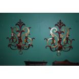 A pair of modern Italian gilt and red metal three branch Wall Lights.
