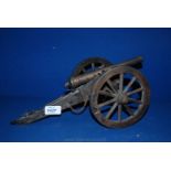 A bronzed and wooden model Cannon