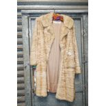 A Ladies 1960's  pale fur knee length coat.