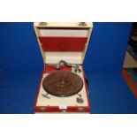 A Decca Gramophone, cream and red case, lacking winder