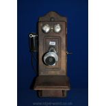 An antique Oak Kellogg wall Telephone, circa 1904-1910