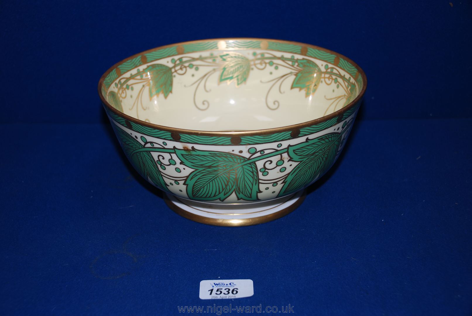 A Minton fruit Bowl in green and cream and gilt ivy leaf motif.